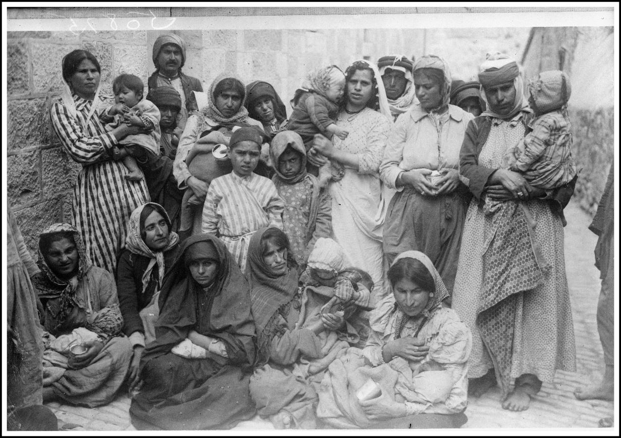 A group of people posing for a photo
Description automatically generated