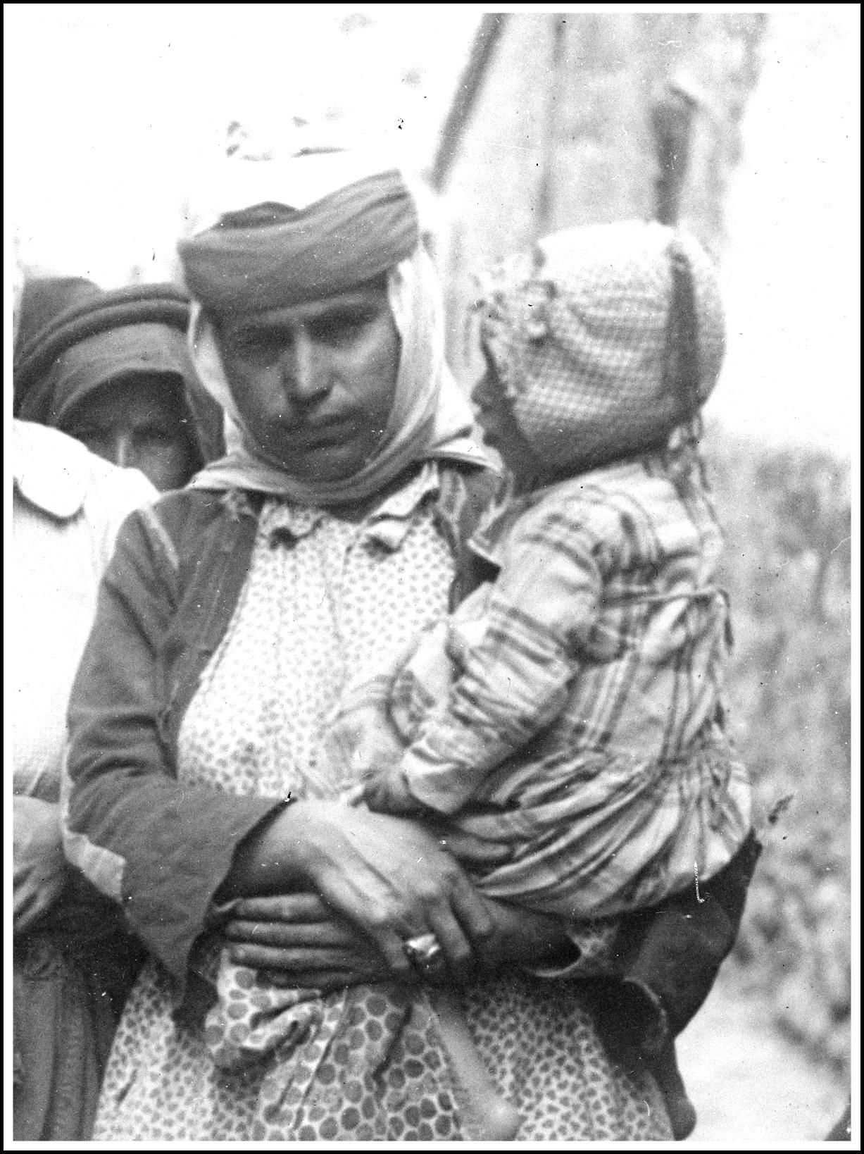 A picture containing text, person, outdoor, person
Description automatically generated